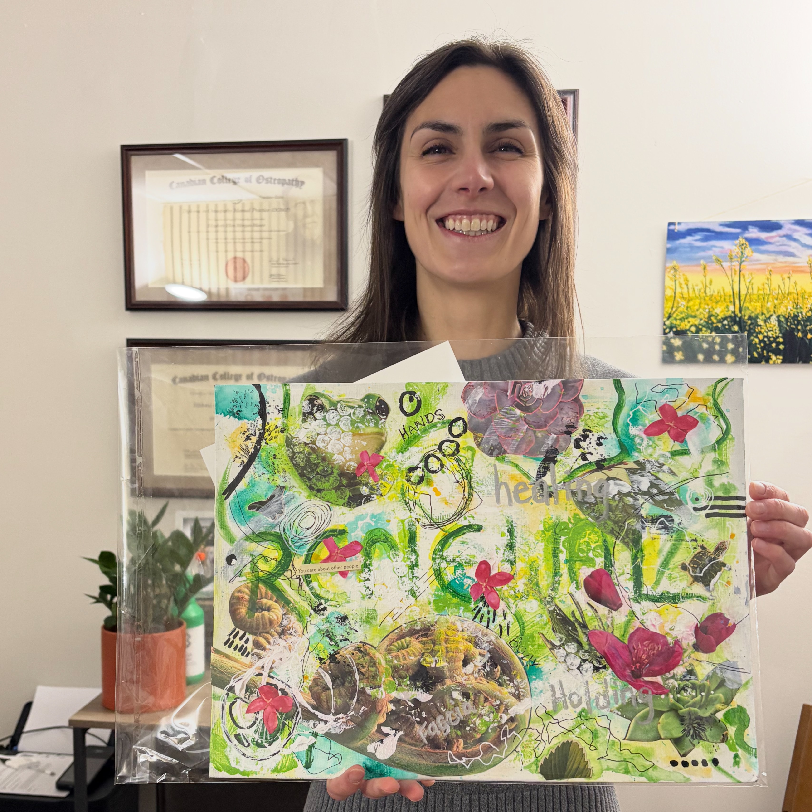 Dana Corkey displaying colorful mixed media artwork