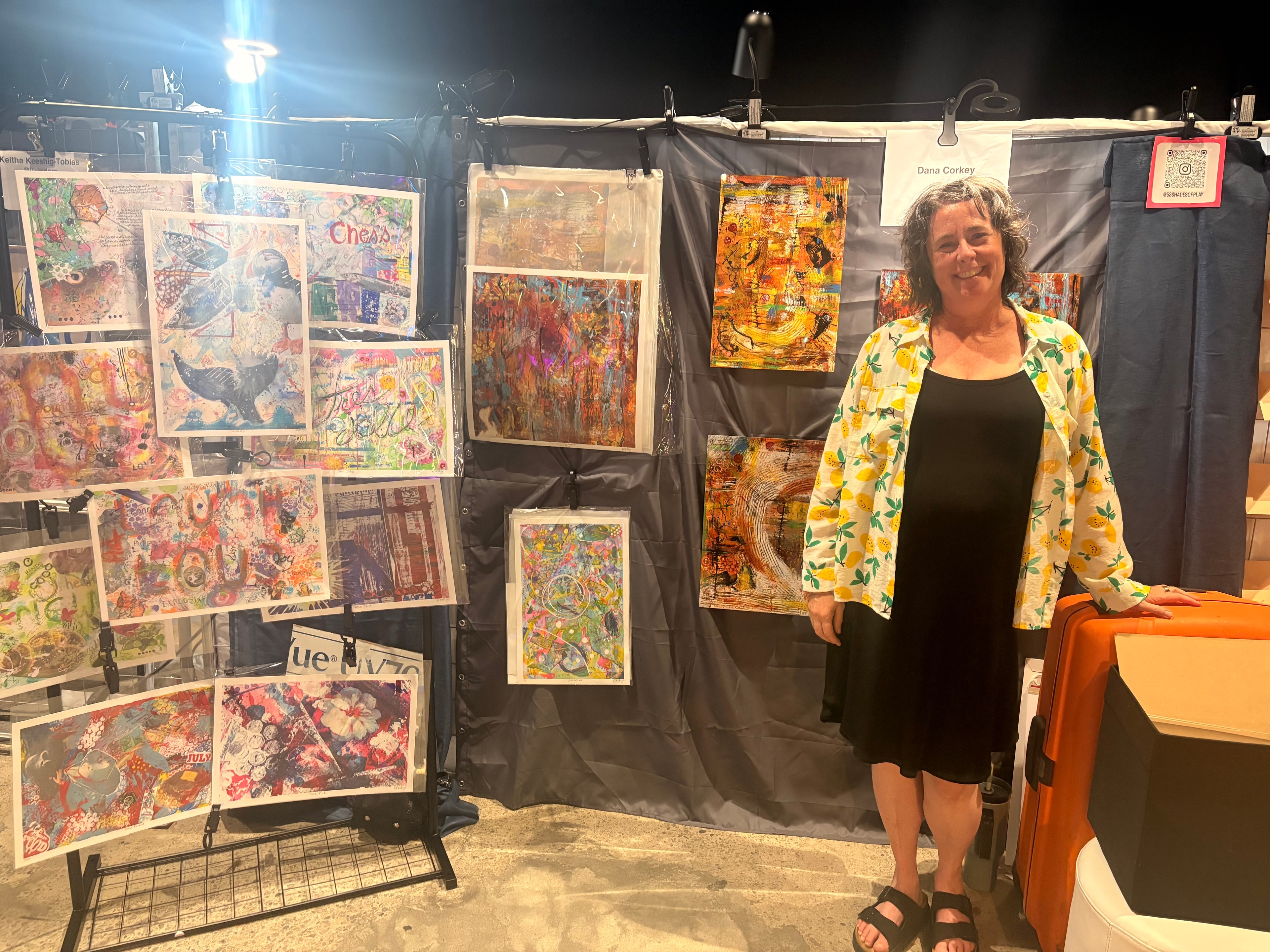 Colorful mixed media artwork displayed on line at exhibition